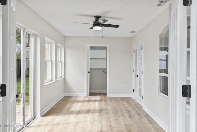 interior space featuring ceiling fan