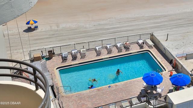 view of swimming pool featuring a patio