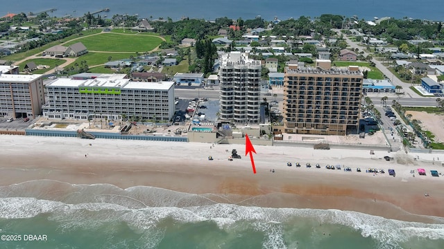 aerial view featuring a water view and a beach view