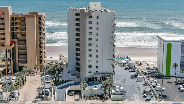 aerial view with a water view and a view of the beach