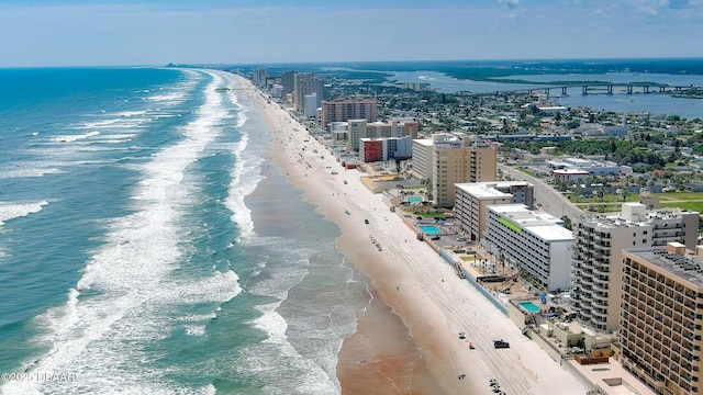 aerial view featuring a water view and a view of the beach