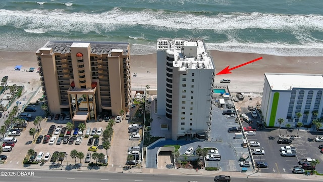 aerial view with a view of the beach and a water view