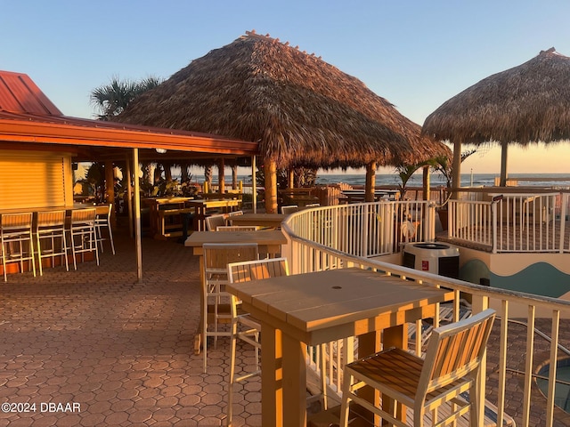 exterior space with an outdoor bar and a patio area