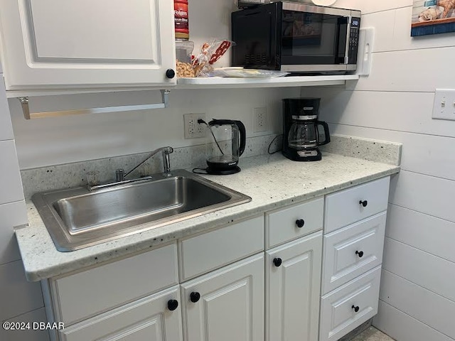 kitchen with white cabinets and sink