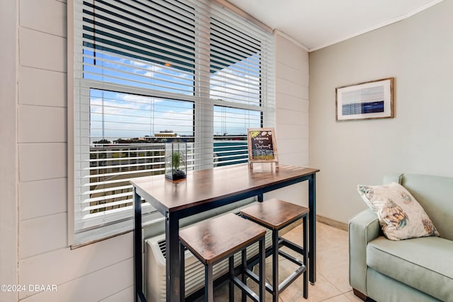 tiled dining space with crown molding