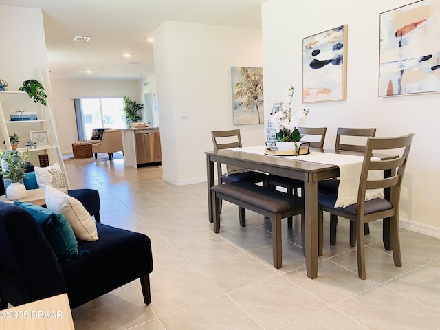 1323 Cork Dr, Ormond Beach, FL 32174 - dining area with light tile patterned flooring, baseboards, and recessed lighting