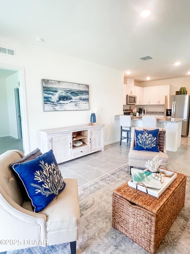 1323 Cork Dr, Ormond Beach, FL 32174 - living room with recessed lighting and light tile patterned floors