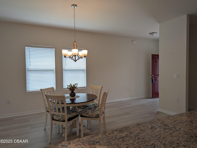 3103 Nova Scotia Way, New Smyrna Beach, FL 32168 - dining room with light wood-style floors and a chandelier