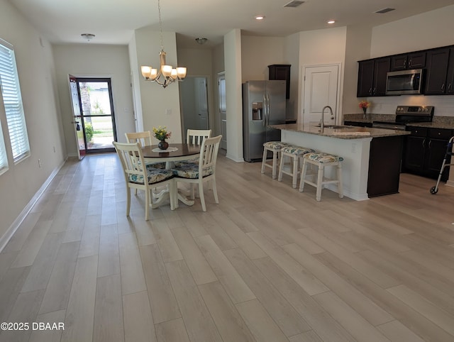 3103 Nova Scotia Way, New Smyrna Beach, FL 32168 - dining space featuring a chandelier, light wood-style flooring, and recessed lighting