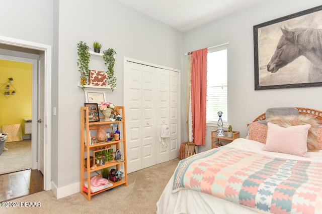 carpeted bedroom with a closet