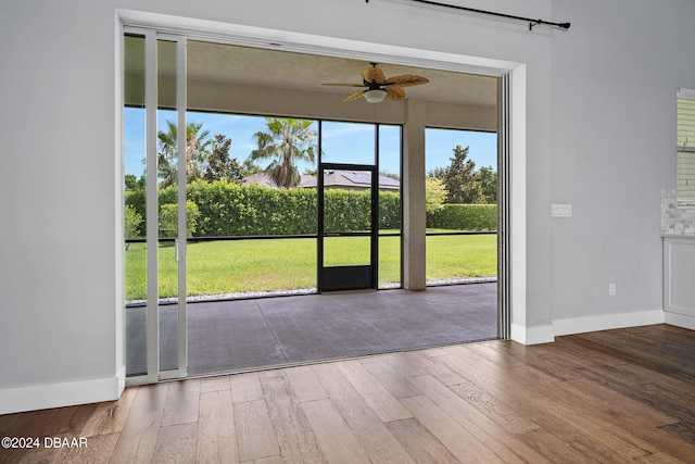 interior space with hardwood / wood-style flooring and ceiling fan