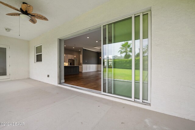 exterior space featuring ceiling fan