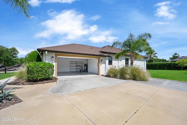 view of front of house featuring a garage and a front yard