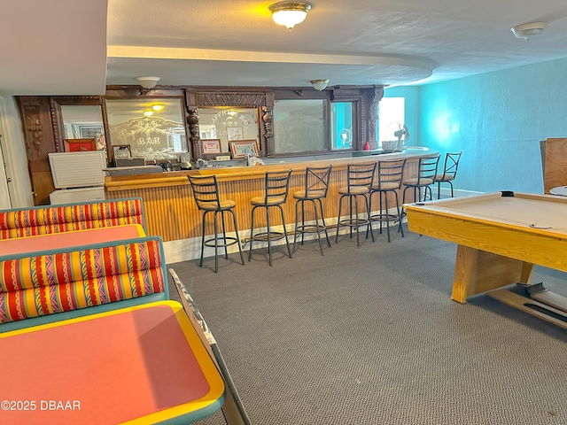 recreation room with carpet floors, a bar, and pool table