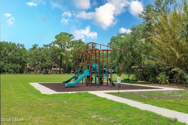 view of jungle gym with a lawn