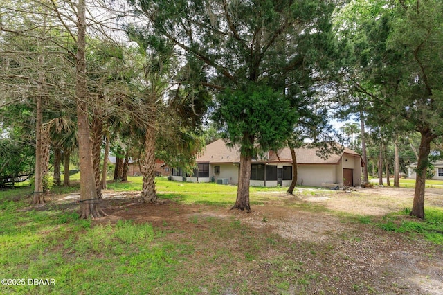 view of yard with a sunroom