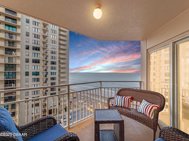 balcony at dusk with a water view