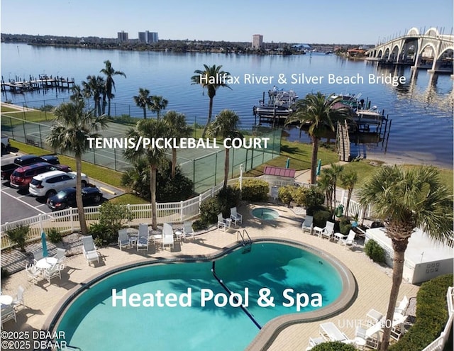 100 Silver Beach Ave Unit 710, Daytona Beach, FL 32118 - community pool featuring a water view, fence, a patio, and a community hot tub