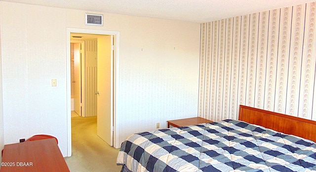 100 Silver Beach Ave Unit 710, Daytona Beach, FL 32118 - carpeted bedroom with wallpapered walls