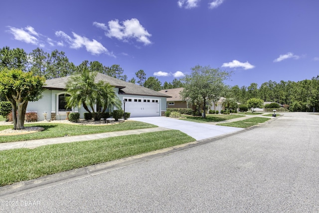 30 Foxfield Look, Ormond Beach, FL 32174 - view of front of home with stucco siding, driveway, a front yard, and a garage