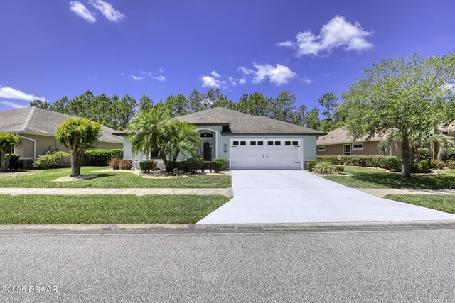30 Foxfield Look, Ormond Beach, FL 32174 - ranch-style home featuring a garage, a front lawn, stucco siding, and driveway