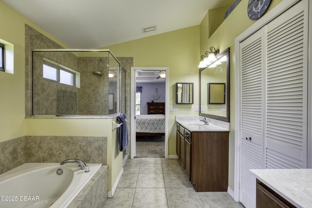 30 Foxfield Look, Ormond Beach, FL 32174 - ensuite bathroom with vanity, visible vents, plenty of natural light, a stall shower, and vaulted ceiling