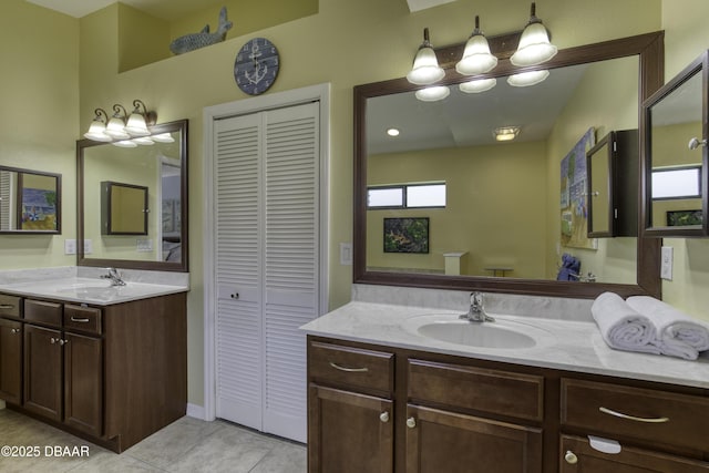 30 Foxfield Look, Ormond Beach, FL 32174 - bathroom featuring a sink, tile patterned flooring, a closet, and two vanities