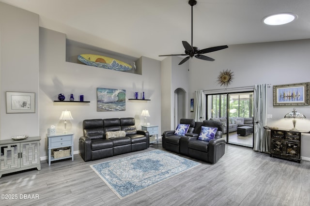 30 Foxfield Look, Ormond Beach, FL 32174 - living area featuring ceiling fan, arched walkways, high vaulted ceiling, baseboards, and wood finished floors