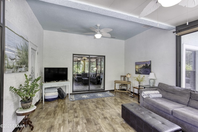 30 Foxfield Look, Ormond Beach, FL 32174 - living area featuring visible vents, a ceiling fan, a textured wall, and wood finished floors