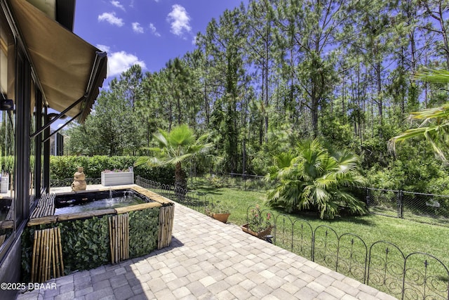 30 Foxfield Look, Ormond Beach, FL 32174 - view of patio with a fenced backyard and a jacuzzi