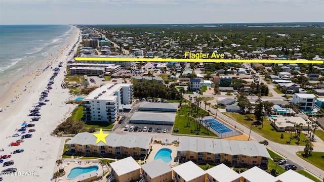 aerial view featuring a view of the beach and a water view