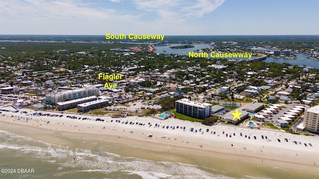 bird's eye view featuring a beach view and a water view