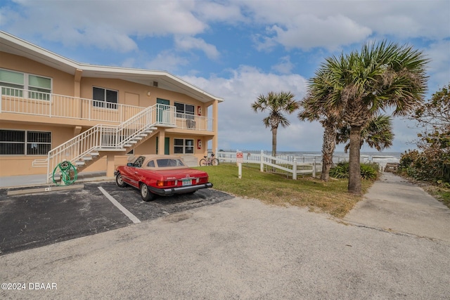 view of front facade with a water view