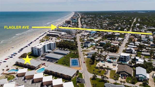 aerial view with a view of the beach and a water view