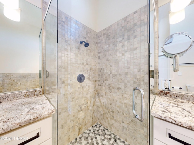 bathroom featuring vanity and walk in shower