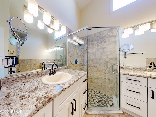 bathroom featuring tile patterned flooring, vanity, and an enclosed shower