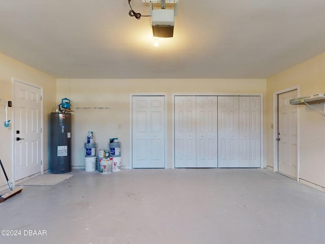 garage featuring a garage door opener and water heater