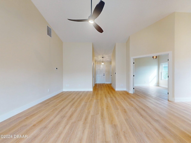 804 Soft Pine Ct, New Smyrna Beach, FL 32168 - empty room with a ceiling fan, light wood-type flooring, baseboards, and high vaulted ceiling
