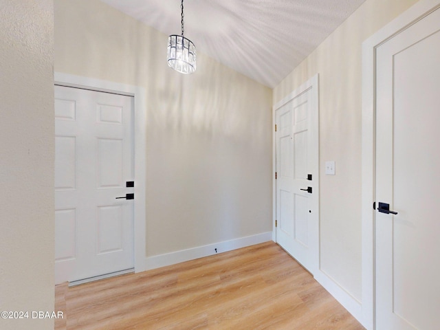 804 Soft Pine Ct, New Smyrna Beach, FL 32168 - foyer featuring light wood-style floors, a chandelier, and baseboards