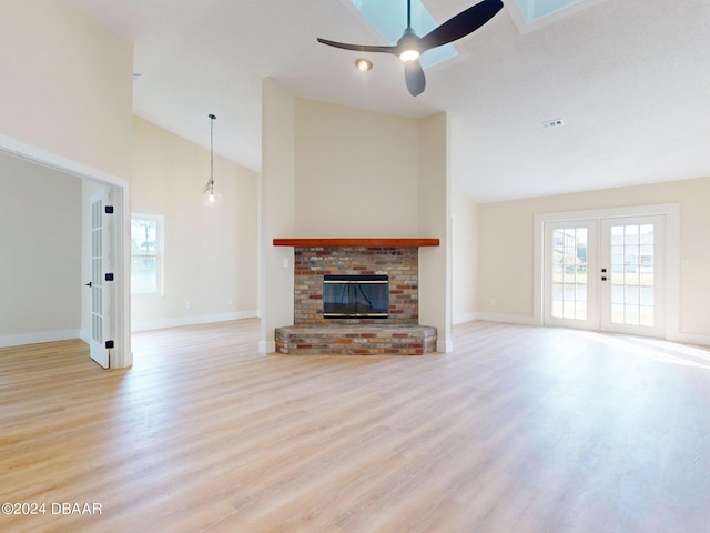804 Soft Pine Ct, New Smyrna Beach, FL 32168 - unfurnished living room with french doors, wood finished floors, ceiling fan, high vaulted ceiling, and baseboards