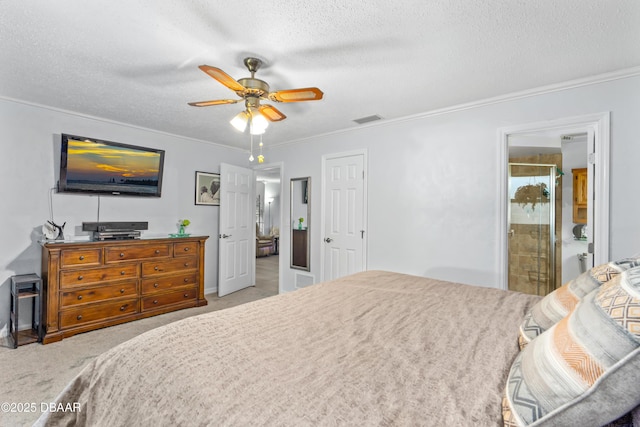 bedroom with carpet floors, a textured ceiling, visible vents, and crown molding