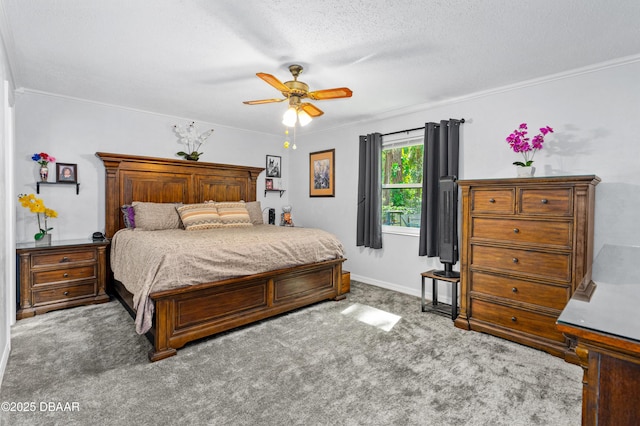 bedroom with baseboards, a ceiling fan, a textured ceiling, crown molding, and carpet flooring