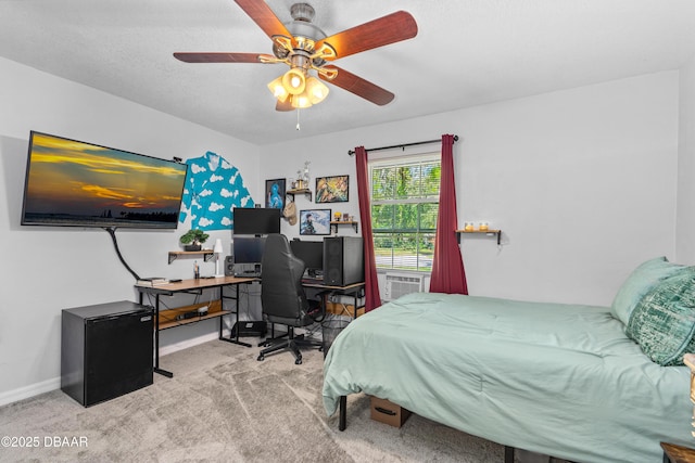 carpeted bedroom featuring ceiling fan, cooling unit, and baseboards