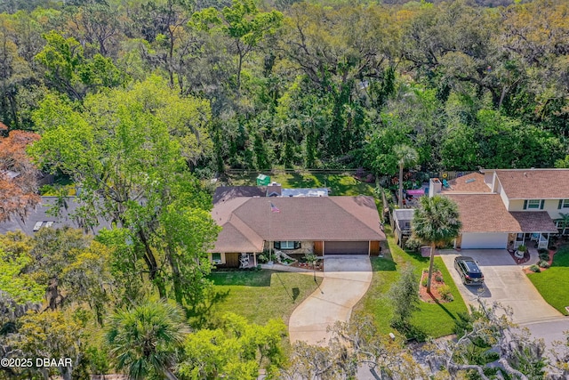 drone / aerial view with a view of trees