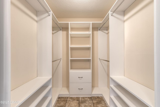 2017 Cornell Pl, Port Orange, FL 32128 - walk in closet featuring tile patterned floors