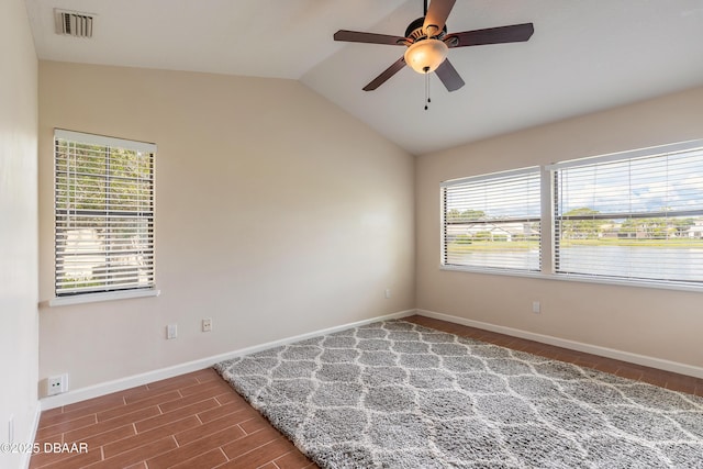 2017 Cornell Pl, Port Orange, FL 32128 - unfurnished room featuring healthy amount of natural light, wood finished floors, vaulted ceiling, and a ceiling fan