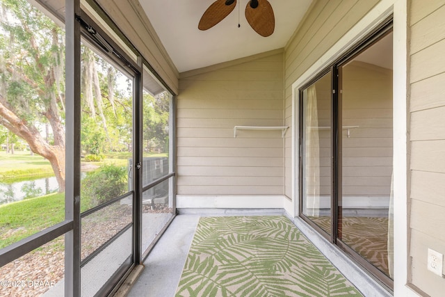2017 Cornell Pl, Port Orange, FL 32128 - unfurnished sunroom featuring ceiling fan, vaulted ceiling, and a water view