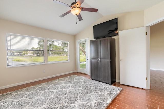 2017 Cornell Pl, Port Orange, FL 32128 - unfurnished bedroom featuring wood finished floors, access to outside, a ceiling fan, and high vaulted ceiling