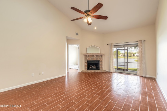 2017 Cornell Pl, Port Orange, FL 32128 - unfurnished living room with high vaulted ceiling, a ceiling fan, a fireplace, dark wood-type flooring, and a water view