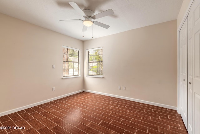 2017 Cornell Pl, Port Orange, FL 32128 - unfurnished bedroom featuring a closet, ceiling fan, and dark wood-type flooring
